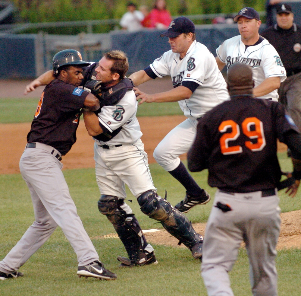 Bluefish catcher John Nathans fights with Long Island Ducks' Jose Offerman during a 2007 game in Bridgeport, Conn. Nathans said he distinctly remembers feeling Offerman’s bat cracking into the back of his head. 