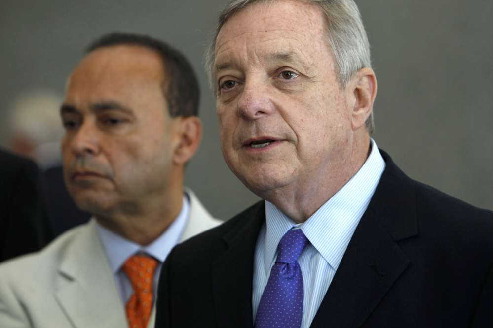 Sen. Dick Durbin, D-Ill., right, is joined by Homeland Security Secretary Jeh Johnson, as he speaks at a June news conference in Chicago. Islamic militants’ growing influence in Iraq and Syria are a threat to Americans, lawmakers from both political parties agreed Sunday even as they sharply disagreed on what role the United States should play in crushing them. The Associated Press