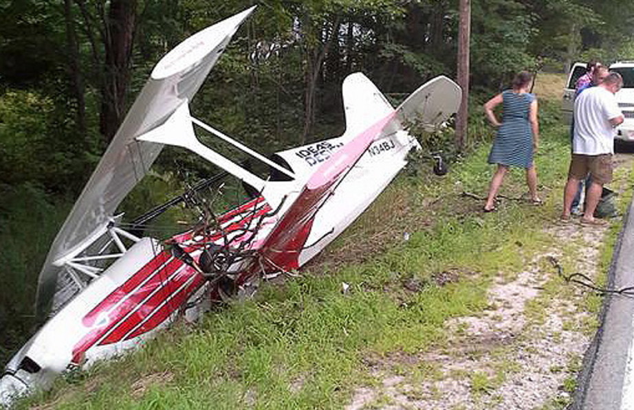 A single-engine plane rests in a ditch beside Rte. 35 in Standish on Sunday. The pilot suffered only minor injuries.