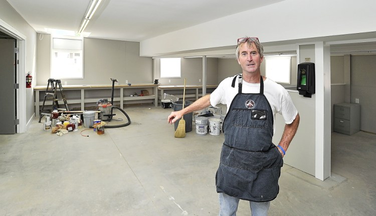 Community Bicycle Center Executive Director Andy Greif stands in  the space that now houses the nonprofit program in Biddeford in this Aug. 11, 2014, photo. The program now has four employees, dozens of volunteers and 400 participants each year.