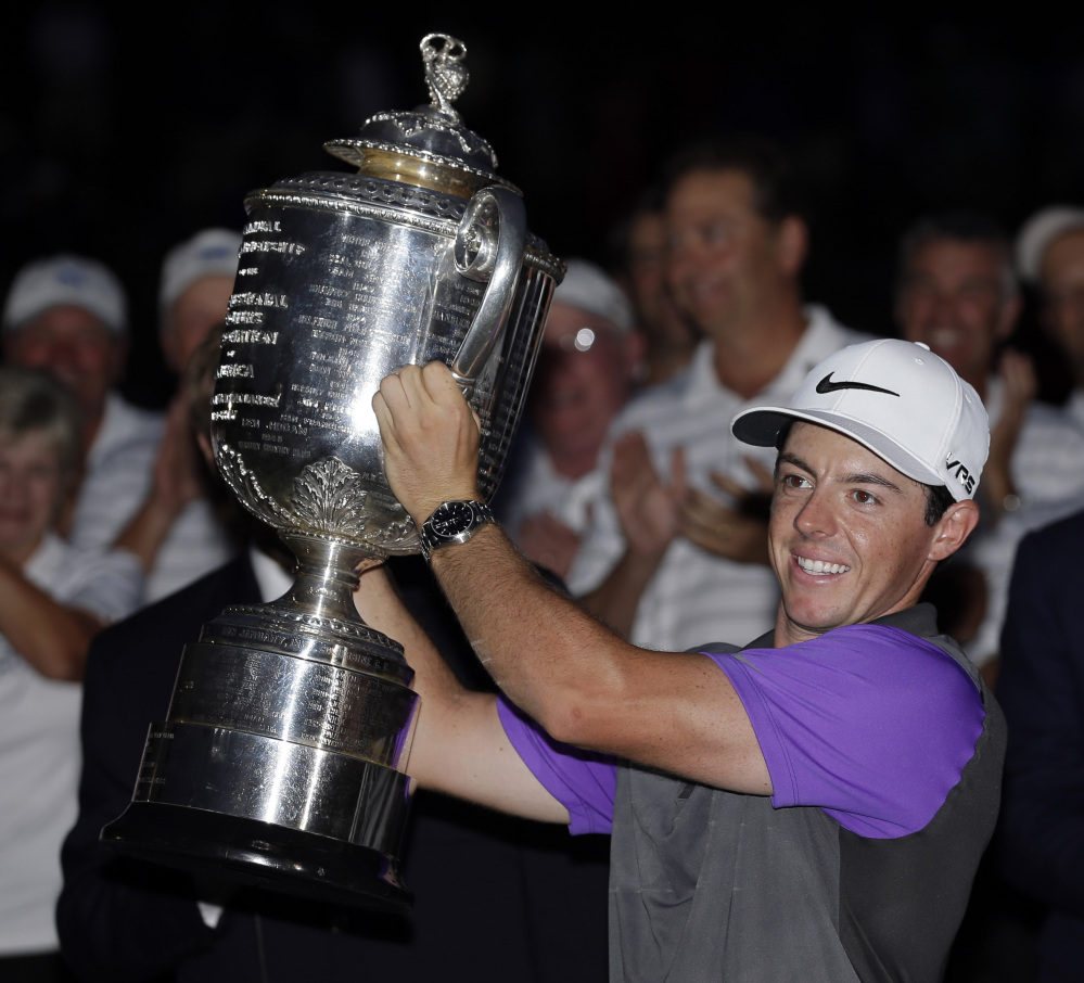 Rory McIlroy holds up the Wanamaker Trophy after winning the PGA Championship on Sunday night at Valhalla Golf Club in Louisville, Ky. McIlroy became one of just four players to win four major championships by the age of 25.