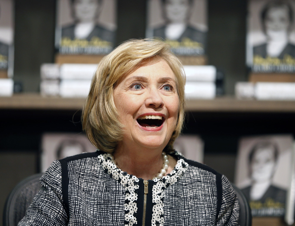 Former Secretary of State Hillary Rodham Clinton, seen greeting a customer during a book signing of her new book, “Hard Choices,” on July 29 in Saratoga Springs, N.Y., has made her most aggressive effort yet to distinguish herself from her former boss, rebuking President Obama for his cautious approach to global crises.