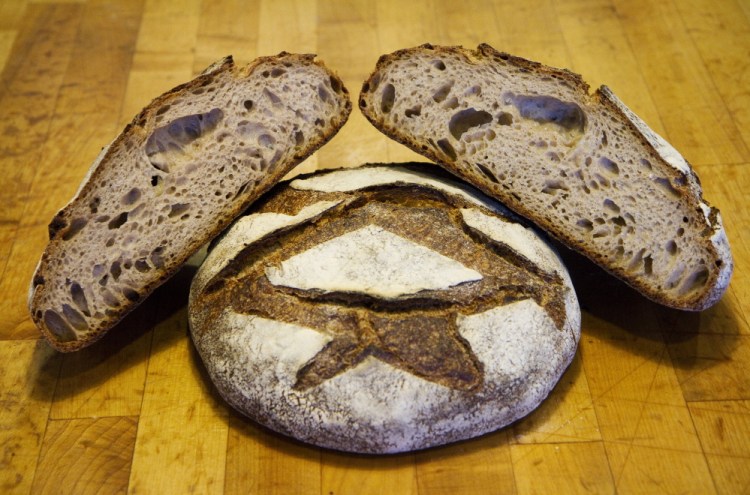 Standard Baking Co. in Portland makes its round miche bread with 100 percent Maine flour. Bakeries around the state are experimenting with using more locally grown grains in both pastries and breads, which often requires changing their baking methods.