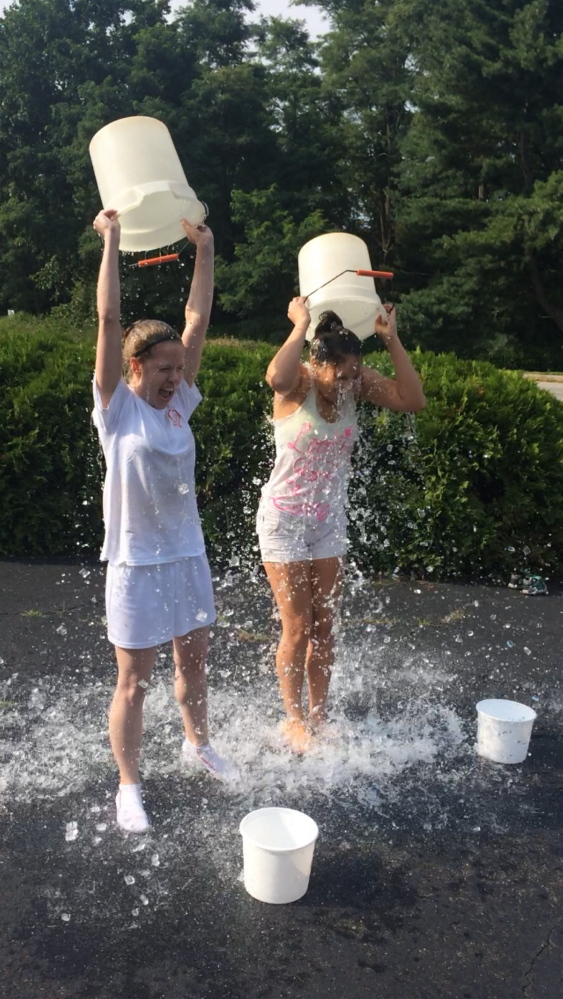 Jillian St.Louis and at right Danna Vaughn, taking the ice bucket challenge. Courtesy of Jennifer St.Louis