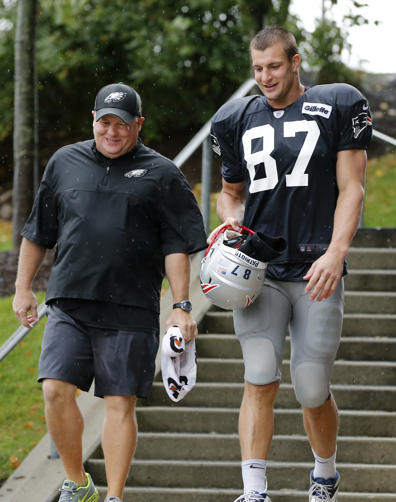 Philadelphia Eagles Coach Chip Kelly, whose mother was raised in Maine and whose parents live in Saco, leaves a joint practice Wednesday with tight end Rob Gronkowski of the New England Patriots.