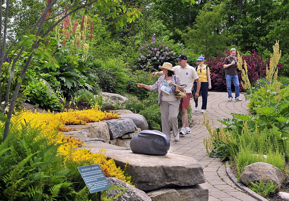 Visitors explore Coastal Maine Botanical Gardens in Boothbay.