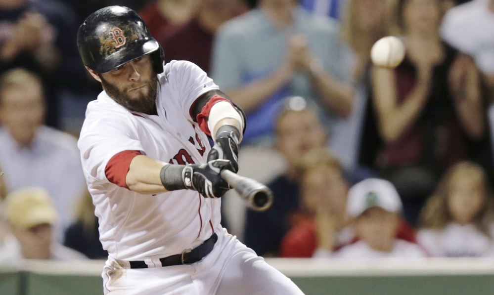 Red Sox second baseman Dustin Pedroia connects for an RBI double, which scored Will Middlebrooks, in the sixth inning against the Houston Astros at Fenway Park on Thursday. The Associated Press