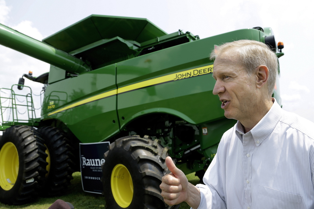 Republican candidate for governor Bruce Rauner talks to central Illinois farmers in Lincoln, Ill.