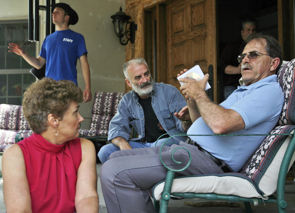 Ed Brown, right, and his wife Elaine Brown listen to Ruby Ridge, Idaho, survivor Randy Weaver, center, at their home in in Plainfield, N.H.