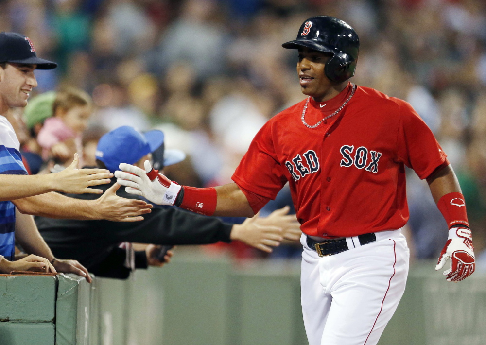 Red Sox outfielder Yoenis Cespedes celebrates his two-run home run in the fourth inning of Friday night’s game against the Houston Astros in Boston.