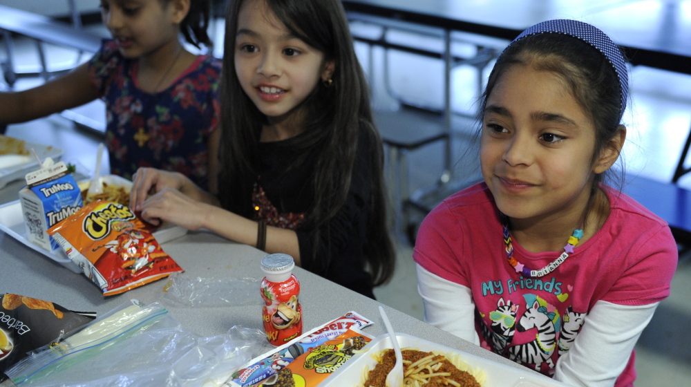 Children eat lunch at Patrick Henry Elementary in Alexandria, Va. Programs that offer Maine kids food outside the normal school day are underutilized.