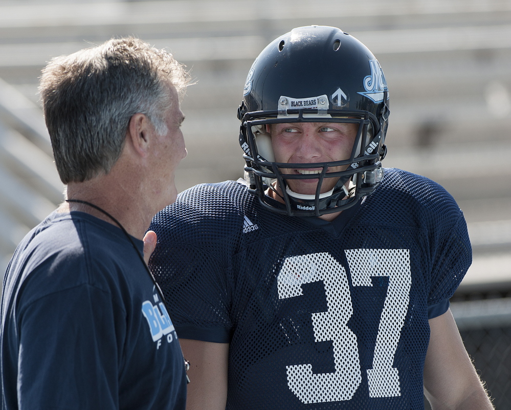 University of Maine Coach Jack Cosgrove, left, will count heavily on kicker Sean Decloux this season as the Black Bears' young offense matures.