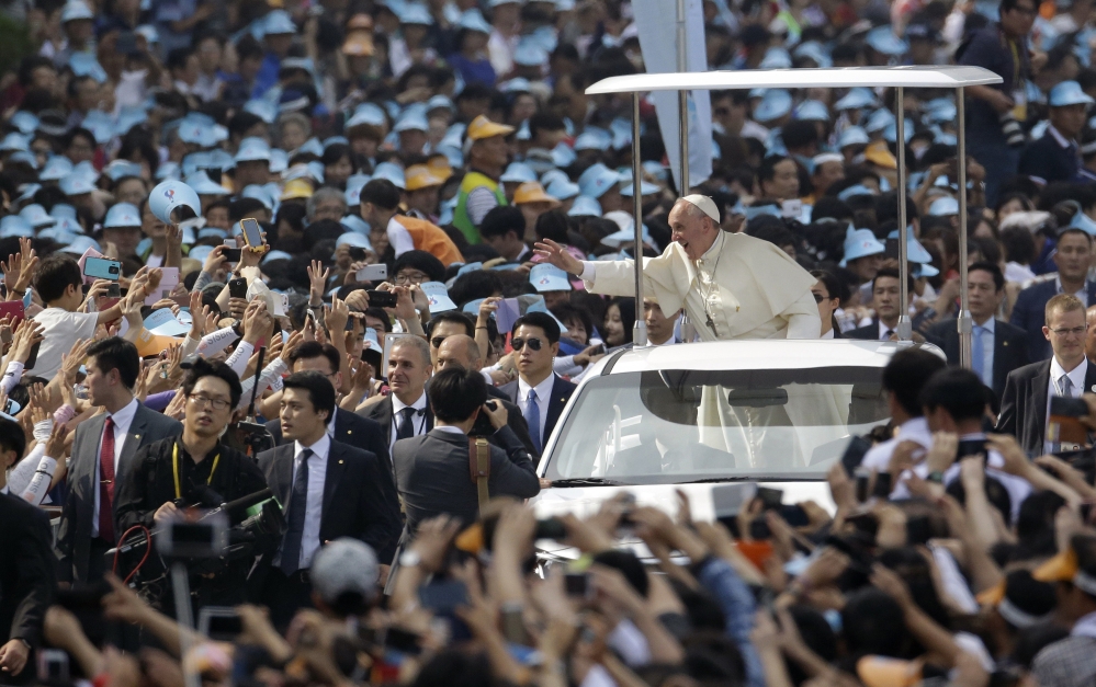 Pope Francis is greeted upon his arrival for a beatification Mass on Saturday in Seoul. Catholics represent only about 10 percent of South Korea’s 50 million people.