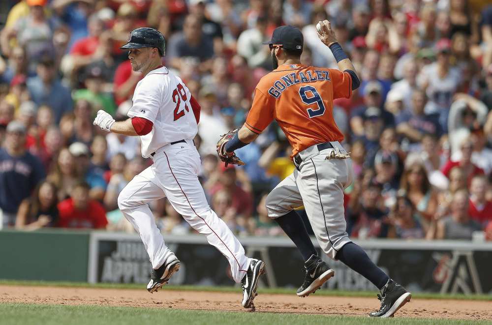 Houston Astros’ Marwin Gonzalez (9) pursues Boston Red Sox’s Daniel Nava in a rundown at second base after he tried to stretch a double during the third inning of a baseball game in Boston, Sunday.