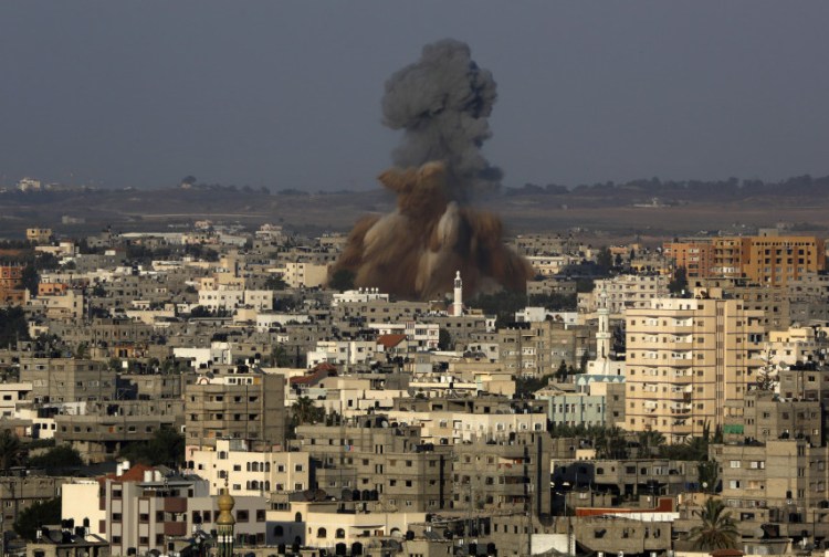 Smoke and debris rise after an Israeli strike hit Gaza City on Tuesday. The Israeli military said it carried out a series of airstrikes across the Gaza Strip in response to renewed rocket fire. The burst of violence broke a cease-fire and endangered negotiations aimed at ending the month-long war between Israel and Hamas.
