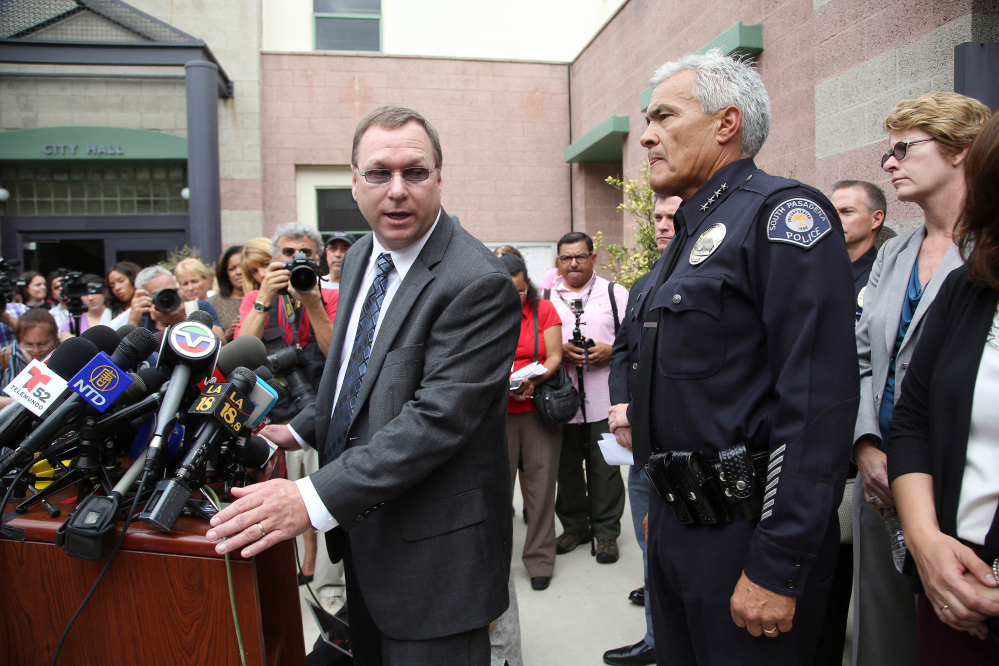 South Pasadena, Calif., police chief Arthur Miller, right, and South Pasadena Unified School District superintendent Dr. Geoff Yanz announce at a City Hall news conference Tuesday, Aug. 19, 2014, that the police has arrested two South Pasadena High School high school students suspected of planning a massacre at the school after investigators monitored their Internet activities. Miller said that school officials had heard about the plot and informed police, who determined the threat was credible. Police say the boys, ages 16 and 17, didn't have weapons but were researching automatic weapons and explosives, especially propane. (AP Photo/ Nick Ut )