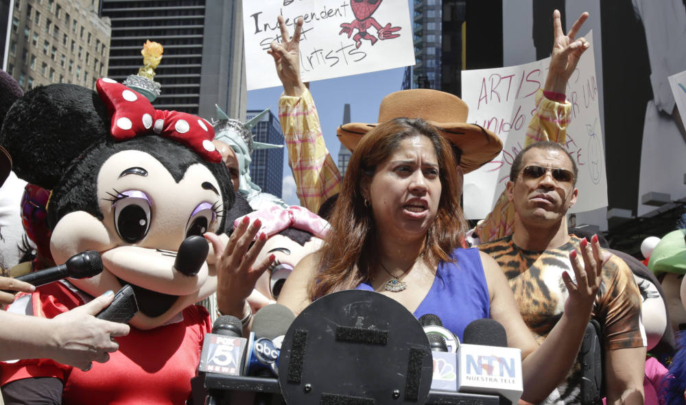 Costumed characters and their supporters gather Tuesday in Times Square.