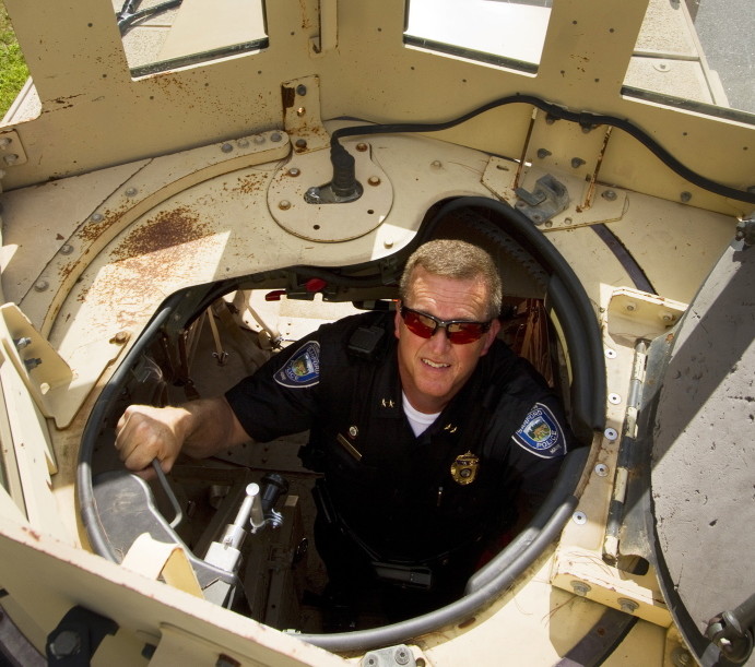 Sanford Police Chief Thomas Connolly on Tuesday looks out the hatch of the department’s mine-resistant vehicle, obtained through a federal procurement program.