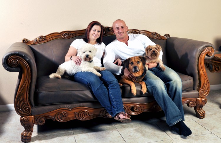 Kris Rotonda, who founded YouMustLoveDogsDating.com, with his girlfriend Denise Fernandez and three of his four dogs, Kobe, a bichon frise, Jordan, a bull mastiff German shepherd and Samoyed mix, and Coco, a Yorkie in Clearwater, Fla. “Dogs on first dates are amazing icebreakers,” said Rotonda, who started up the site last year that now has 2 million members. “You find out right off the bat how everyone in a relationship will fit in.”