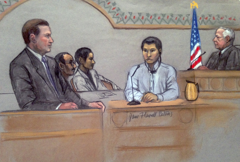 In this courtroom sketch, Dias Kadyrbayev, center, testifies in federal court in June 2 in Boston. Kadyrbayev is accused of removing items from marathon bombing suspect Dzhokhar Tsarnaev’s dorm room several days after the 2013 bombings.