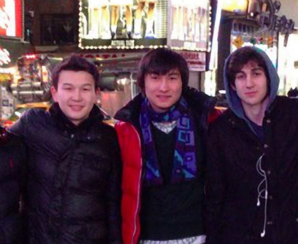 In this file photo, Azamat Tazhayakov, from left, Dias Kadyrbayev and Dzhokhar Tsarnaev pose at Times Square in a framegrab from Tsarnaev’s page on VKontakt, the Russian equivalent of Facebook. Tazhayakov and Kadyrbayev are accused of removing evidence from Tsarnaev’s dorm room after the marathon bombing.