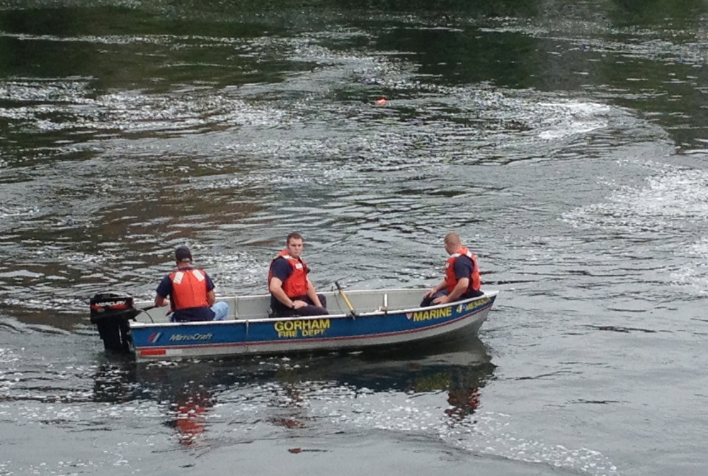 Rescue workers search the Presumpscot River in Westbrook Thursday morning after reports that a man had gone missing in the river.