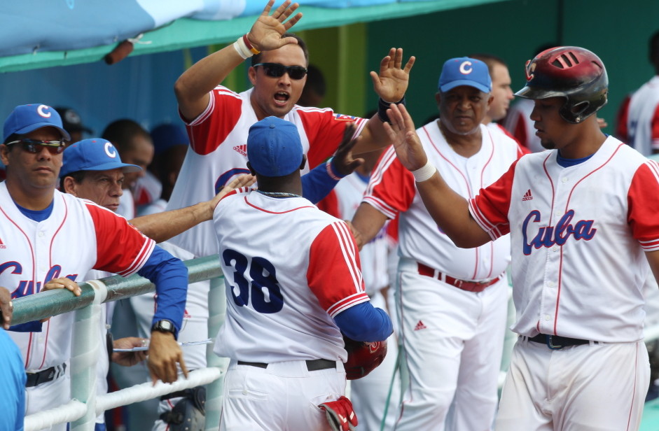 Cuba’s Rusney Castillo (38) celebrates with teammates after scoring during a baseball game against Venezuela at the Pan American Games in Lagos de Moreno, Mexico. Castillo has been signed by the Red Sox, according to media reports.