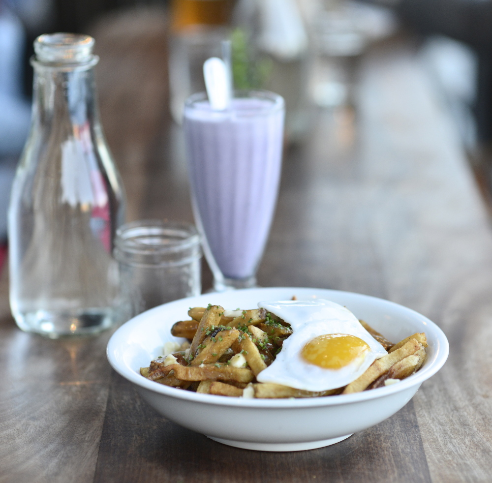 Duckfat’s poutine features fries, a duck egg, duck gravy and cheese curds.