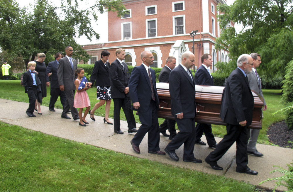 The casket of Sen. Jim Jeffords is carried from a church in Rutland, Vt., on Friday. Jeffords, who died Monday at age 80, is known for his 2001 defection from the Republican Party, becoming an independent and passing control of the Senate to the Democrats.