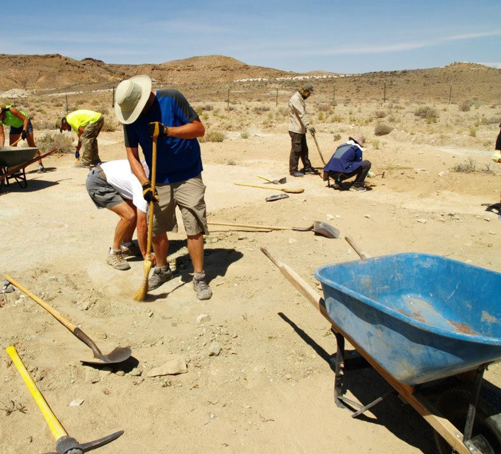 Researchers and volunteers clean the surface of a site on Bureau of Land Management lands north of Moab, Utah.The Associated Press