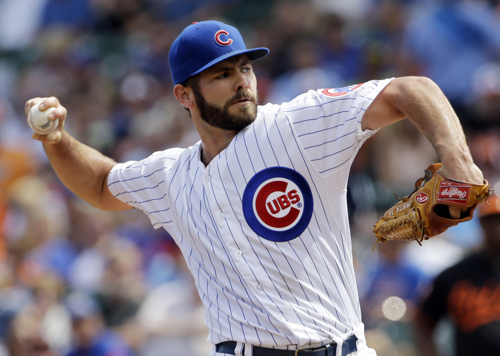 Chicago Cubs starter Jake Arrieta allowed four hits in seven innings and beat his former team, the Baltimore Orioles, in Chicago on Friday. The Cubs won 4-1.