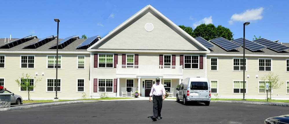 FARMINGTON,ME.-JULY 8: Brookside Village resident Alan Sawyer Sr. walks to his vehicle parked in front of the energy efficient senior housing facility in Farmington on Tuesday, July 8, 2014. (Photo by David Leaming/Staff Photographer)