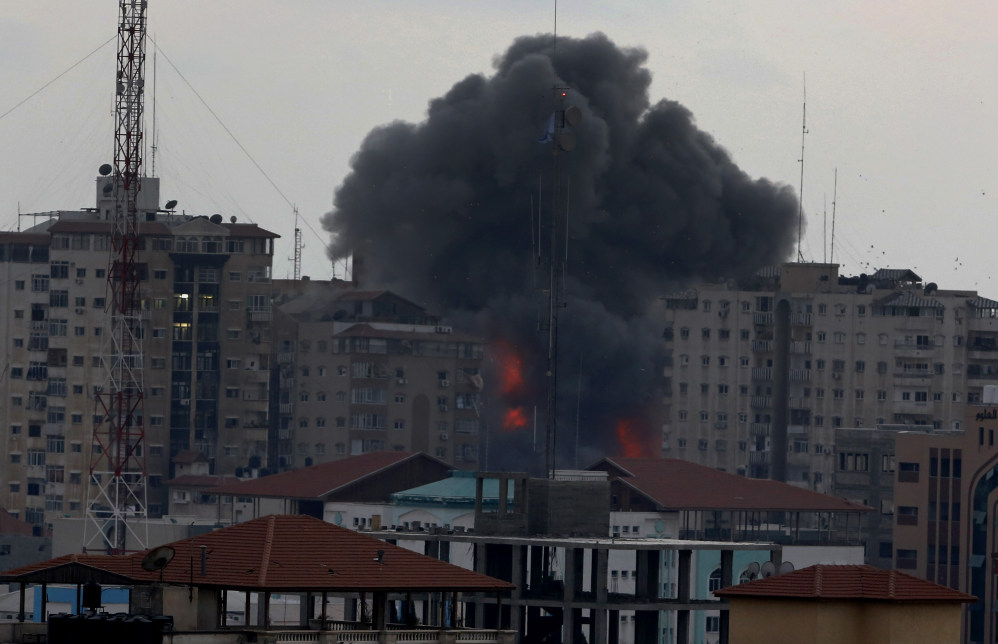Smoke rises from an apartment tower in Gaza City on Saturday after an Israeli airstrike that displaced 44 families.