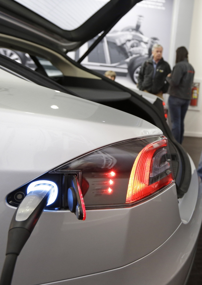 A Tesla electric car gets charged up earlier this year at a showroom in Cincinnati, Ohio.