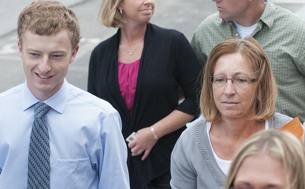 Carole J. Swan, former Chelsea selectwoman, with her younger son, John Swan, enters the U.S. District Court building June 13 in Bangor for her sentencing hearing on extortion, tax fraud and workers’ compensation fraud.