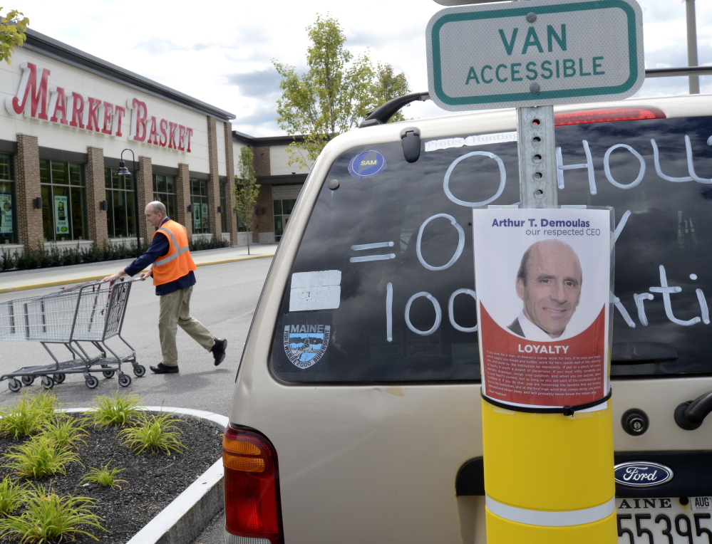 An employee at the Market Basket in Biddeford tries to stay busy Saturday while the company’s board of directors met to consider the latest offer from Arthur T. Demoulas. The board has not announced any additional meetings.