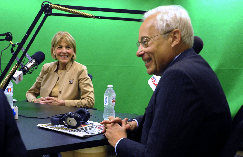 Democratic gubernatorial candidate Donald Berwick smiles as Martha Coakley looks on during a debate Monday.
