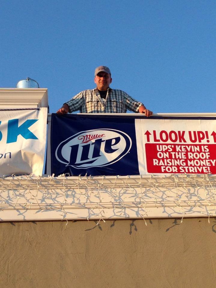 Kevin Fitzpatrick on the roof of Jimmy the Greek’s restaurant at the Maine Mall.