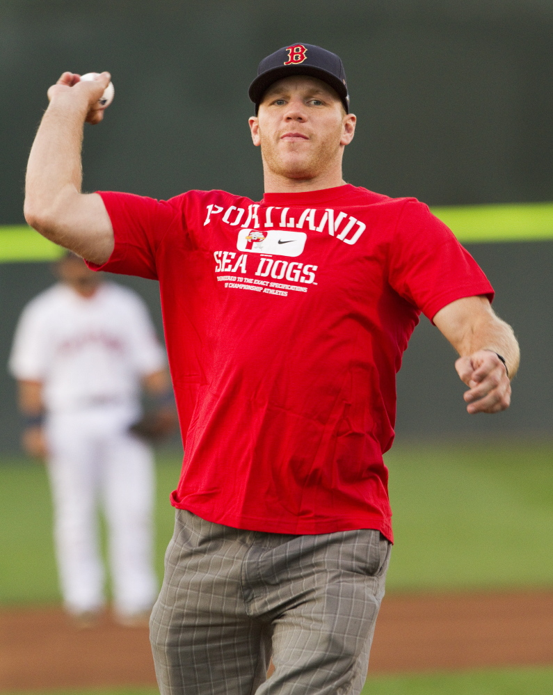Boston Bruins left wing Shawn Thornton throws out the first pitch before the Portland Sea Dogs play the Reading Fightin Phils at Hadlock Field on Tuesday.
Carl D. Walsh/Staff Photographer