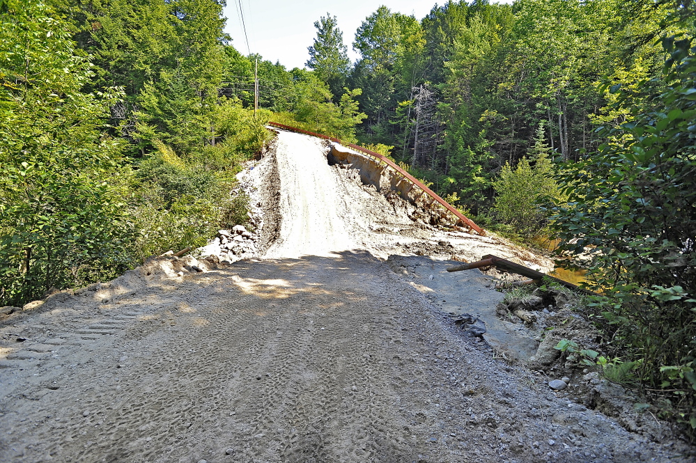 The road is now partially usable after a construction crew put in a culvert and added tons of fill to make it temporarily passable. A permanent repair could cost as much as $85,000.