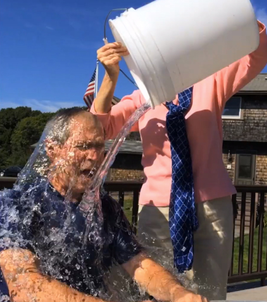 Former President George W. Bush participates in the “ice bucket challenge” with the help of his wife, Laura Bush, in Kennebunkport. The challenge is “like a modern-day chain letter,” said the author of a book on why things catch on.