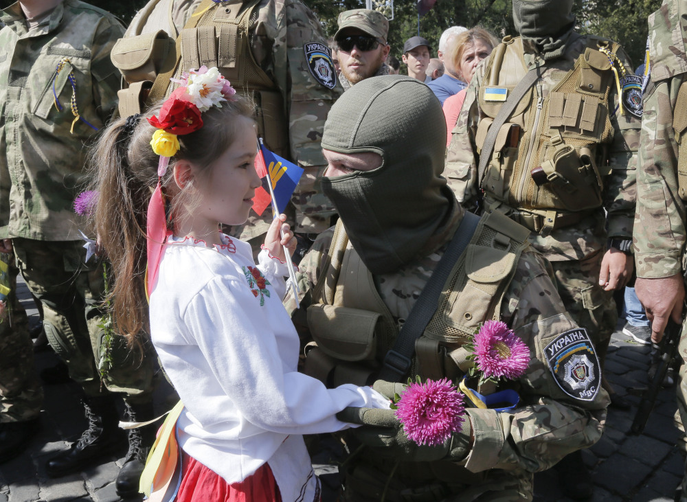 Loved ones say goodbye to volunteers in Kiev going to fight against pro-Russian separatists Tuesday.