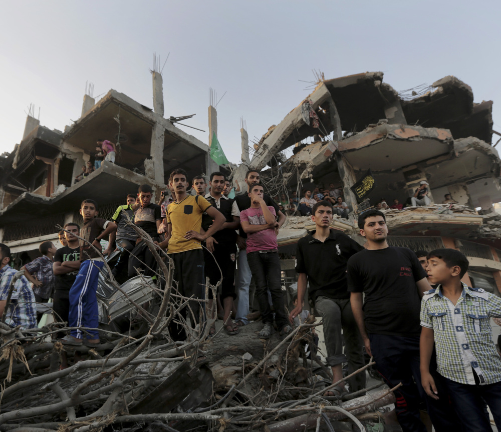 Palestinians attend a victory rally organized by Hamas at the debris of destroyed houses in Shijaiyah, a neighborhood in Gaza City, on Wednesday.