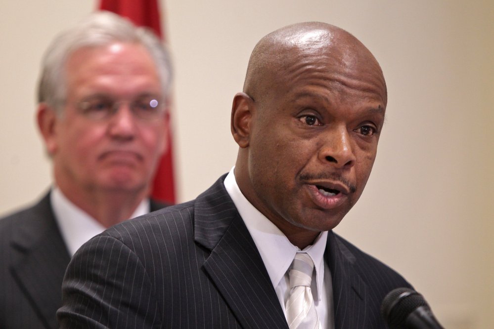 Former St. Louis police chief Daniel Isom II speaks after being named director of the Missouri Department of Public Safety at a news conference Wednesday with Gov. Jay Nixon, left.