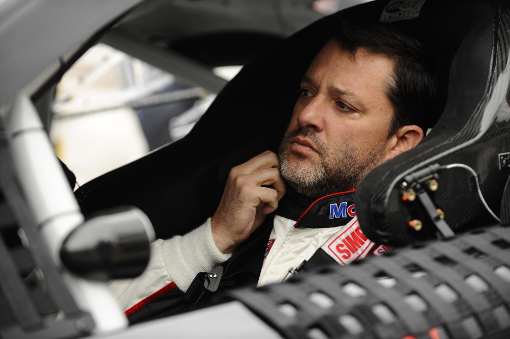 Tony Stewart, seen preparing to start a NASCAR Sprint Cup series race in April, will return to Sprint Cup competition Sunday night, ending the three-race hiatus he has taken since he struck and killed a fellow driver during a dirt-track race.