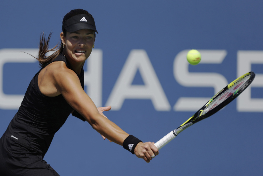 Ana Ivanovic of Serbia returns a shot against Kirolina Pliskova of the Czech Republic in Thursday’s second-round match at the U.S. Open. Ivanovic, seeded eighth, was upset by Pliskova in straight sets.