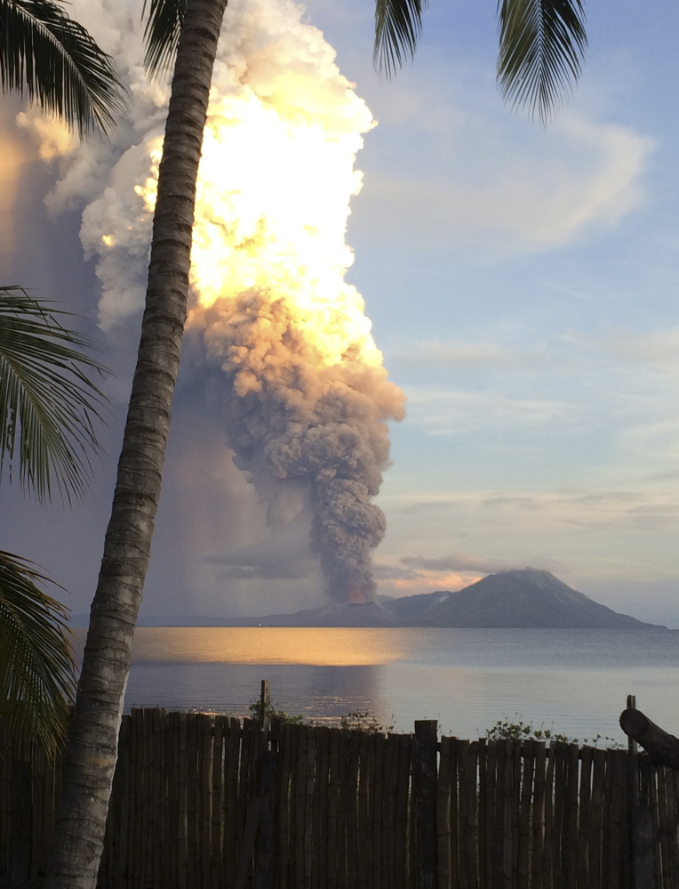 A huge smoke billows from Mt. Tavurvu after an eruption in Kokopo, east New Britain, Papua New Guinea.