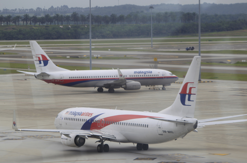 A Malaysia Airlines plane taxies out on the tarmac for departure at Kuala Lumpur International Airport in Sepang, Malaysia, on Friday.