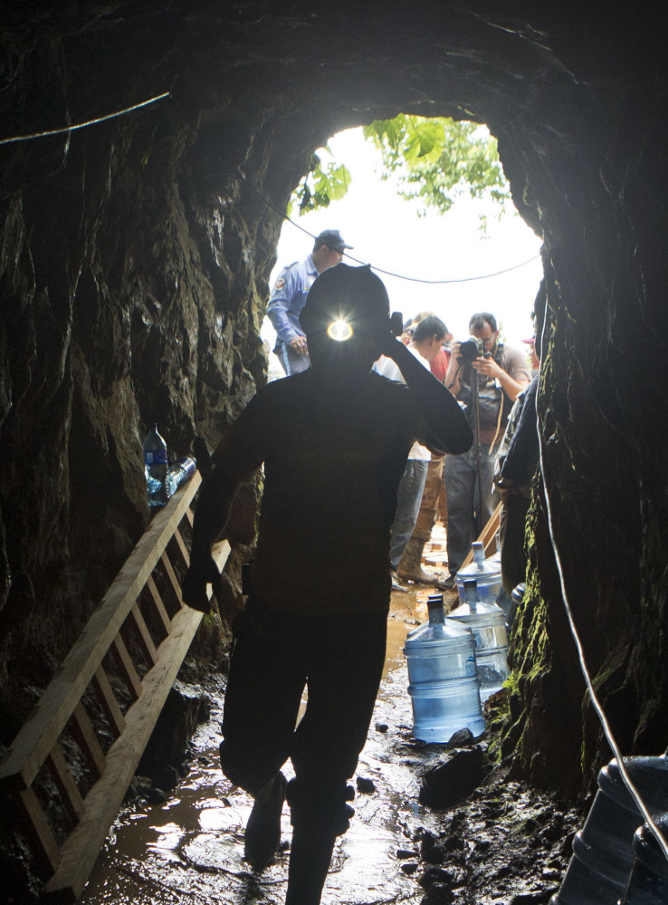 A miner enters the El Comal gold and silver mine to help with rescue operations Friday.