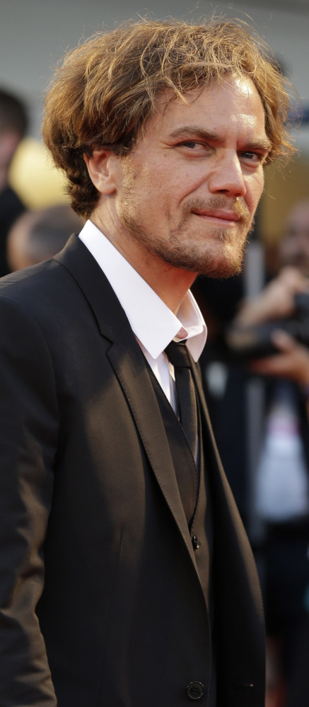 Actors Michael Shannon, above, and Andrew Garfield, below, arrive for the premier of “99 Homes” at the 71st Venice Film Festival in Italy on Friday. The film’s director, Ramin Bahrani, said he was “dizzied by the corruption” in Florida when he was researching his Orlando-set drama on the subprime crisis.